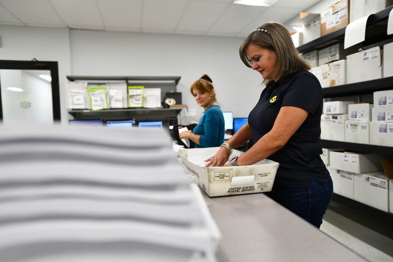 A Southeastern employee sorting mail