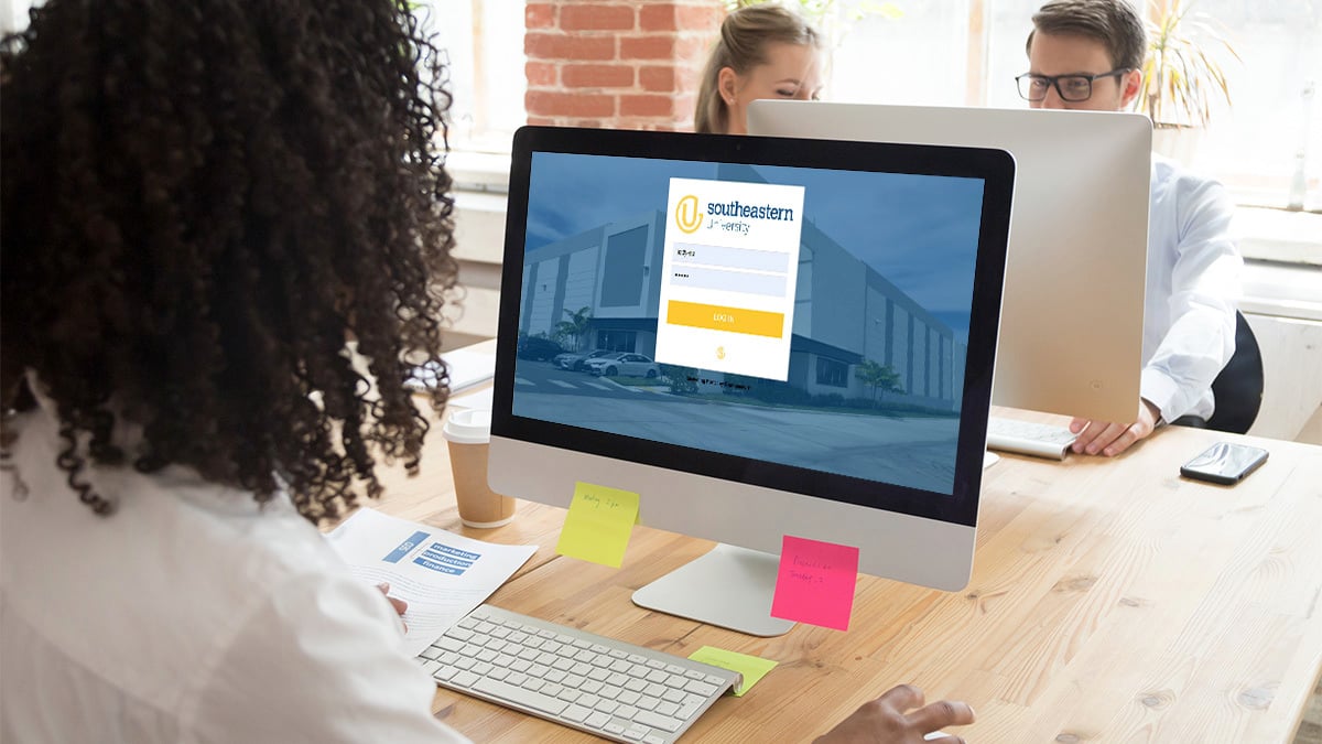 Woman looking at login screen for Southeastern's portal