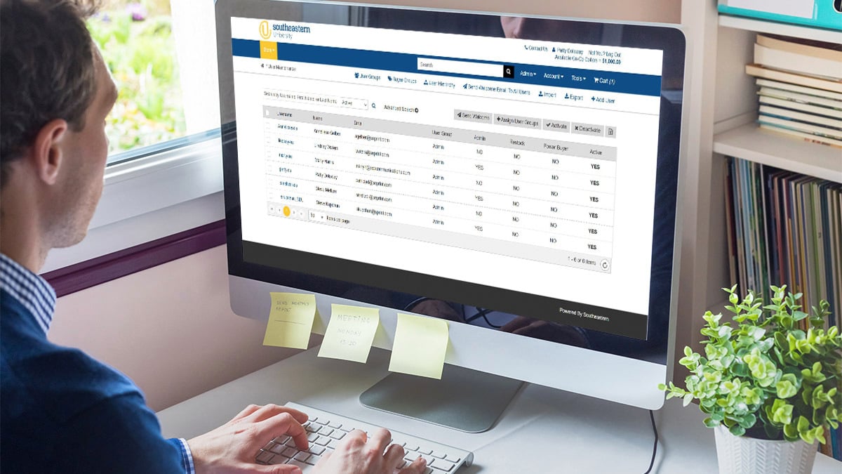 Man looking at his company's orders on Southeastern's dashboard on a desktop computer