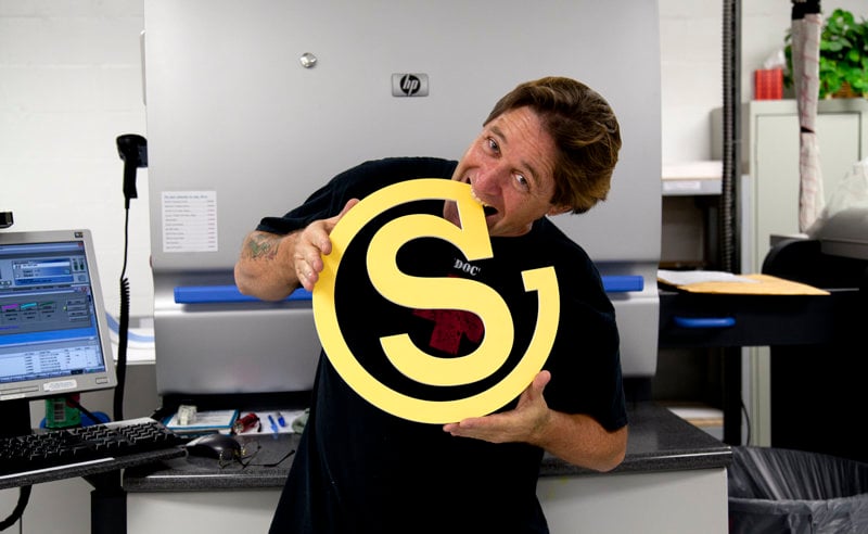 Southeastern employee taking a bite out of company logo