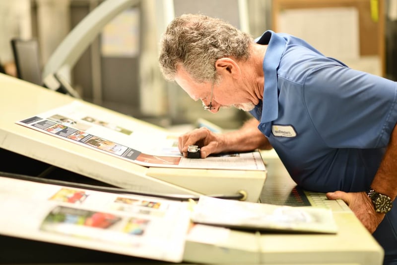 Southeastern employee inspecting a printed document