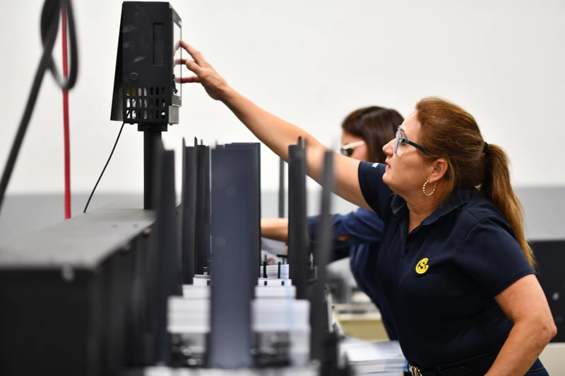 Southeastern employees at large printing press