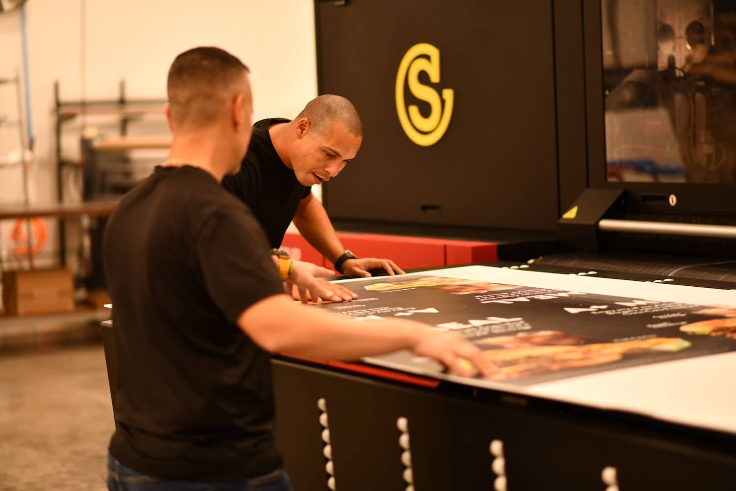 Two Southeastern employees inspecting a printed piece