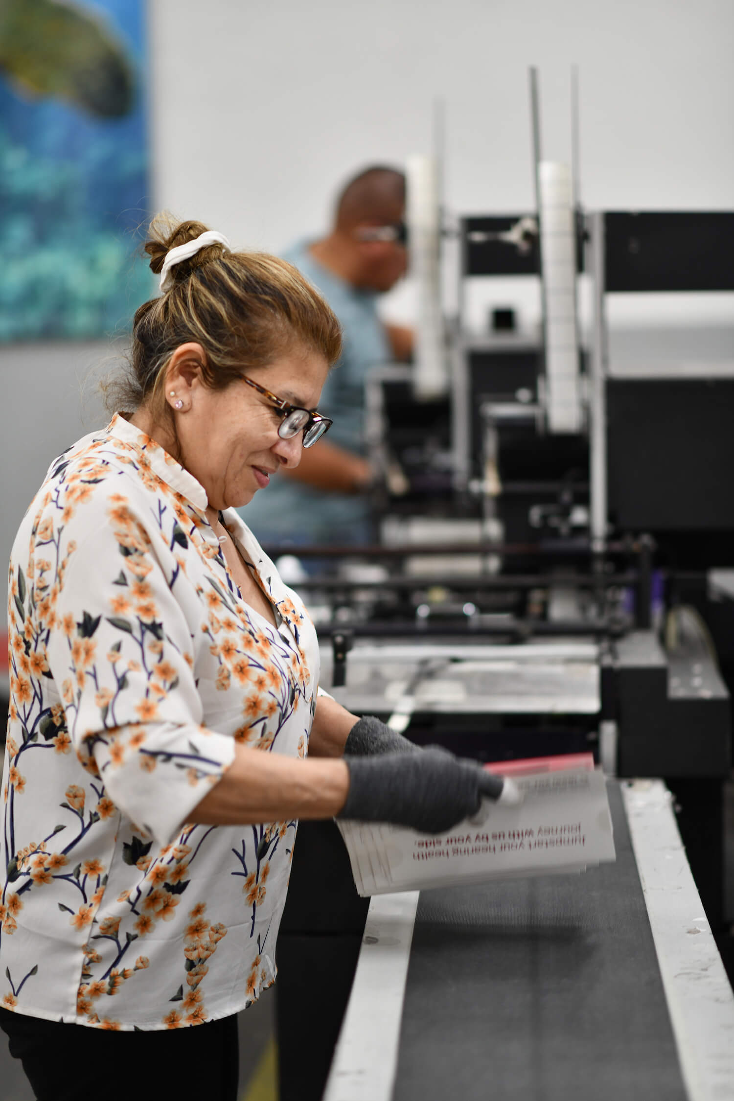 Woman sorting printed pieces