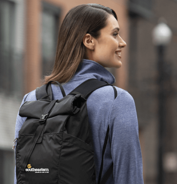 Young woman wearing a Southeastern Printing promotional product backpack. (1)